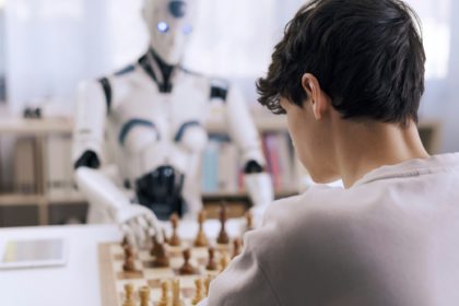 Intense competition: boy vs. robot chess match