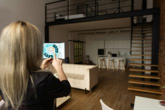 Smart home control on tablet. Interior of living room in the background